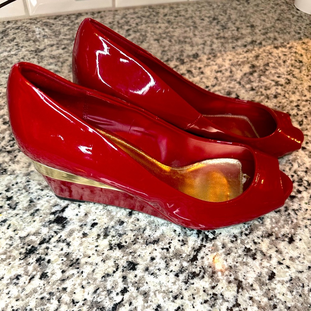 Size 11 Red and gold wedge heels. Used